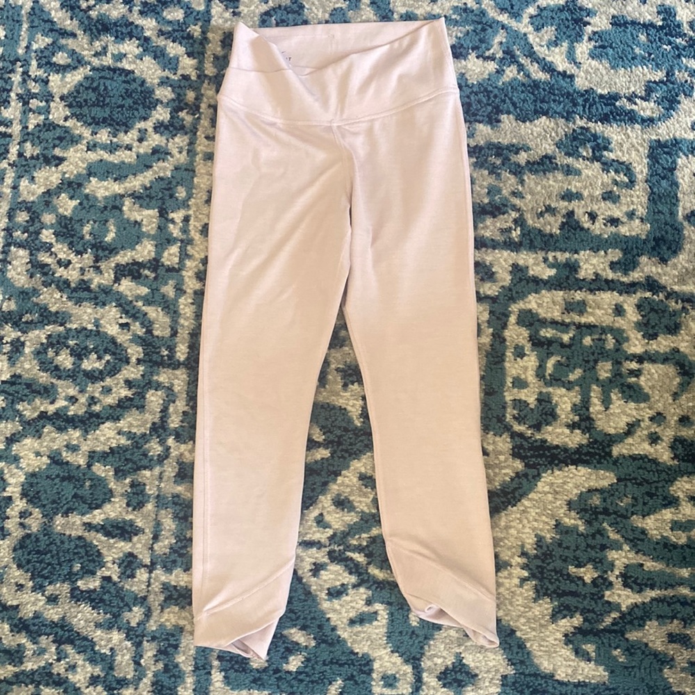 Nike size small, pale pink color, cross over band, excellent condition.